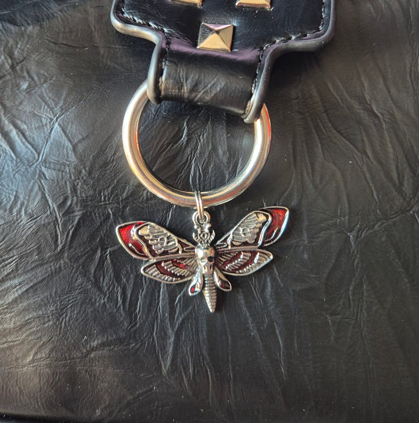 Red moth charm rivet studded handbag