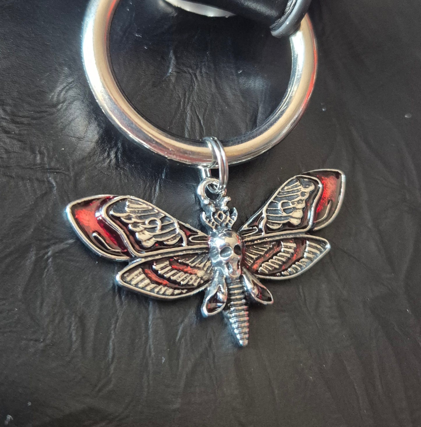 Red moth charm rivet studded handbag