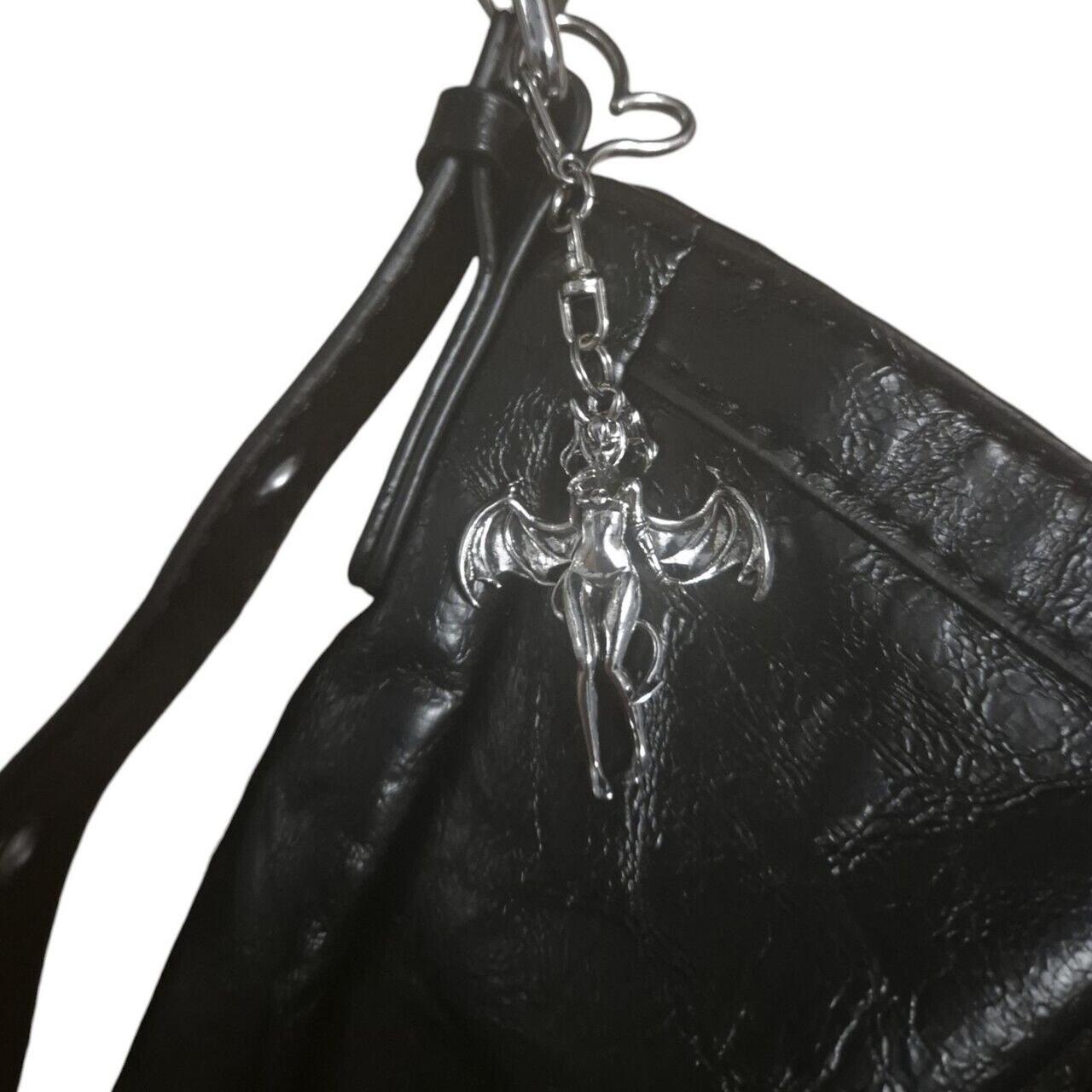 Devilish charm & barbed wire hearts handbag