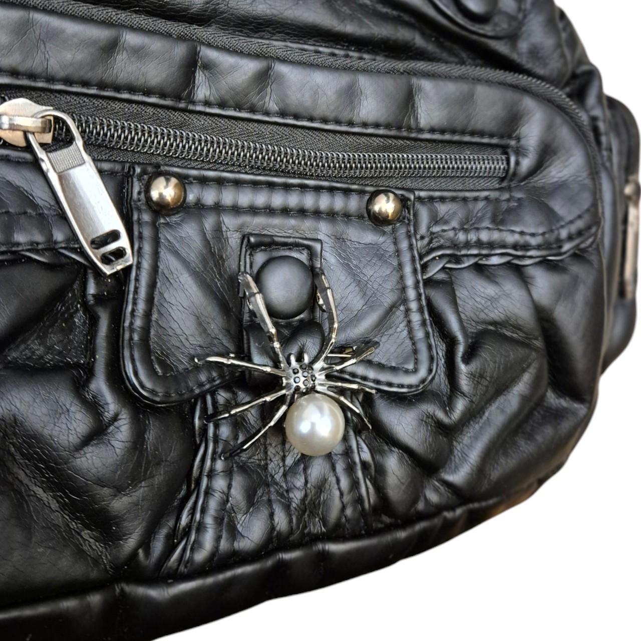 Spider brooch accent handbag
