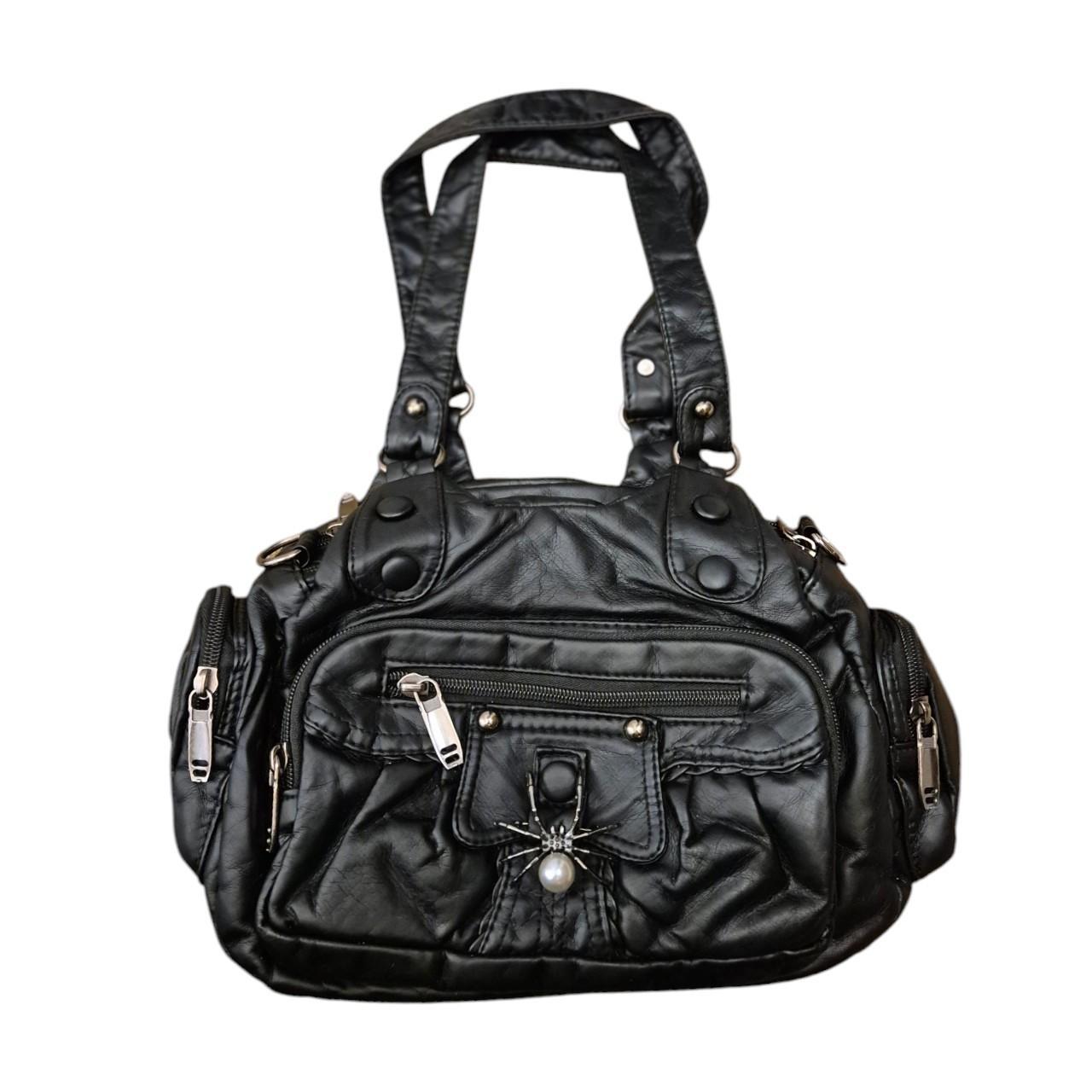Spider brooch accent handbag